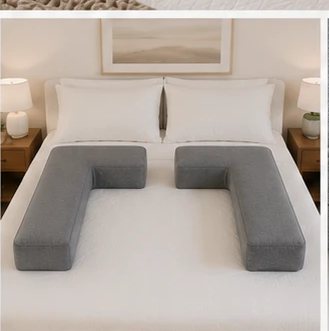 Two pillows framing a bed